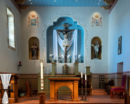 San Carlos Cathedral interior with altar and cross, Monterey, California, USA