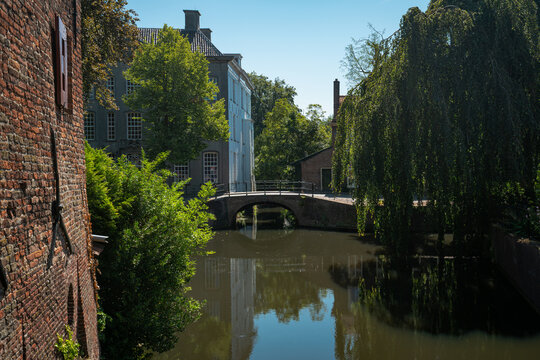 Brick canal wall and small bridge in historic Amersfoort