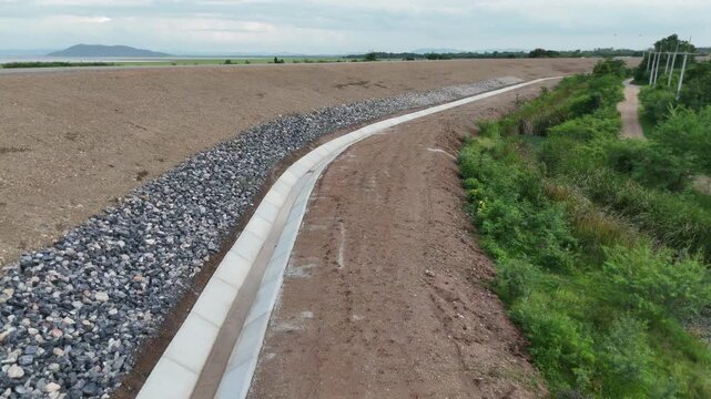 Cement canals are used to drain water from high roadsides in rural areas.