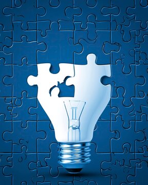 Light Bulb Shaped Puzzle Piece Missing from Blue Jigsaw Puzzle Composition