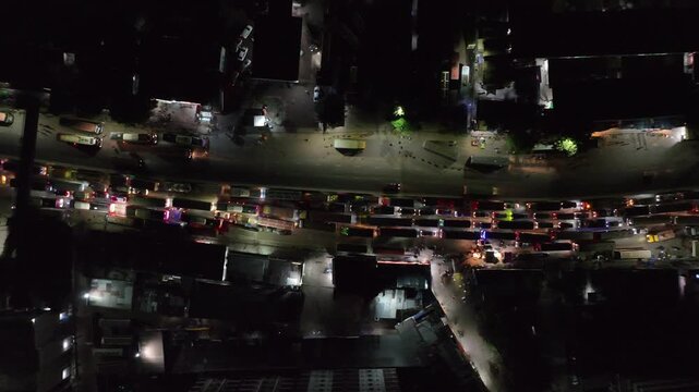 Aerial top down view of heavy traffic jam at night in asian city