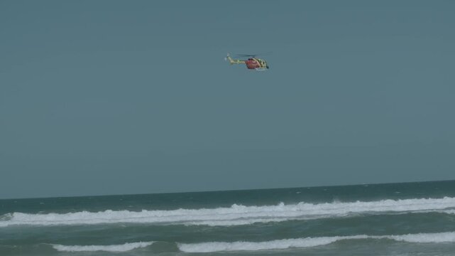 Westpac Lifesaver Rescue Helicopter Flying Over Ocean in Slow Motion