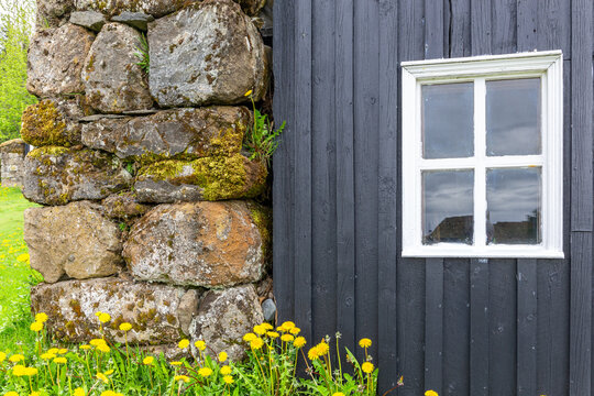 Traditional turf house black wood facade at Skogar Museum Iceland