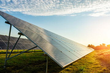 Large solar panel system installed on a green field countryside © Aliaksandr