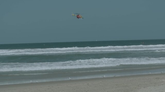 Westpac Lifesaver Rescue Helicopter Flying Over Sunshine Coast Beach