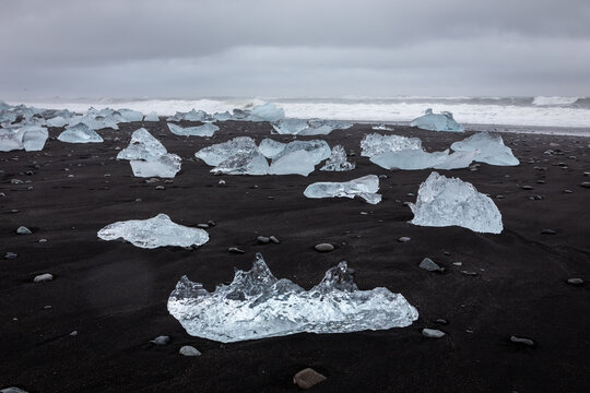 Diamond Beach Jokulsarlon glacial ice blocks on black sand in Iceland