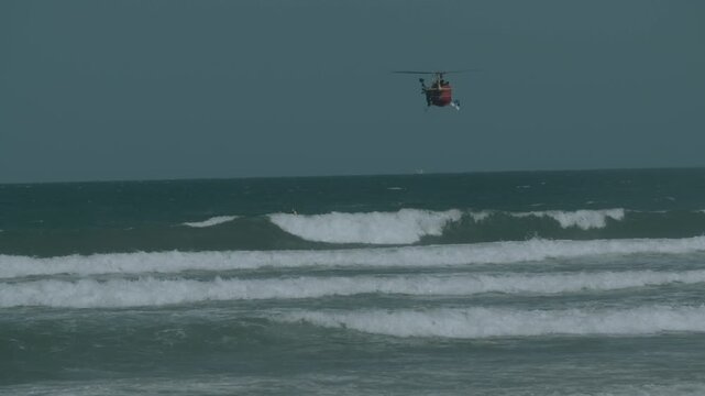 Westpac Lifesaver Rescue Helicopter Flies Over Waves on Sunshine Coast