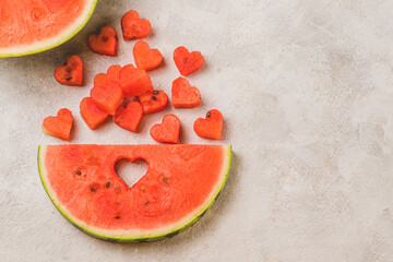 Obraz premium A piece of watermelon with the flesh cut out to the shape of hearts
