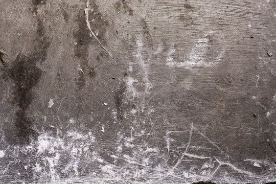 Aged rough concrete floor surface texture background with white scratches and marks