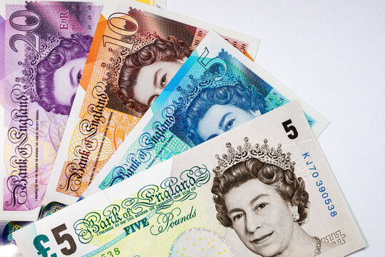 British currency, featuring various Great Britain Pound (GBP) banknotes including 5, 10, and 20 pound notes with Queen Elizabeth II portrait. Money of Europe.