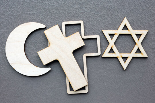 Symbols of the three monotheistic religions&mdash;Christianity, Islam, and Judaism&mdash;representing interfaith dialogue. These icons illustrate faith, spirituality, and peaceful coexistence.