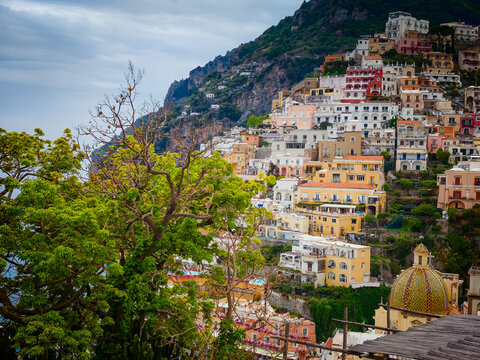 Stunning aerial drone panorama of Positano on the Amalfi Coast, Italy, colorful hillside houses, dramatic cliffs and the Mediterranean Sea
