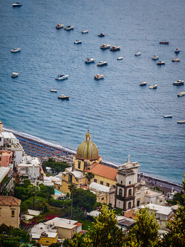Church of Saint Mary of the Assumption in Positano, Italy, iconic historic church with its colorful majolica dome overlooking the stunning Amalfi Coast