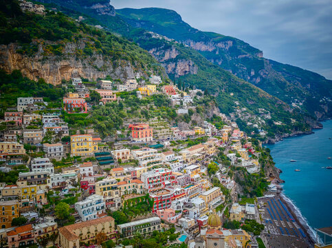 Stunning aerial drone panorama of Positano on the Amalfi Coast, Italy, colorful hillside houses, dramatic cliffs and the Mediterranean Sea