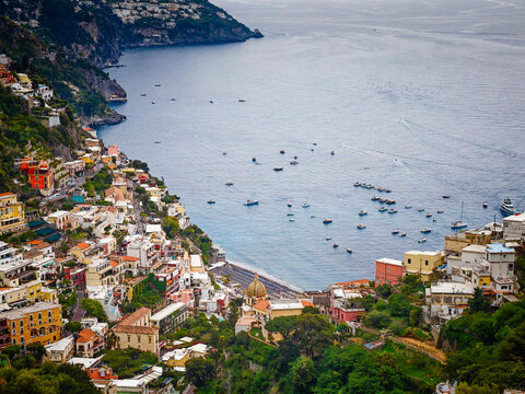 Stunning aerial drone panorama of Positano on the Amalfi Coast, Italy, colorful hillside houses, dramatic cliffs and the Mediterranean Sea