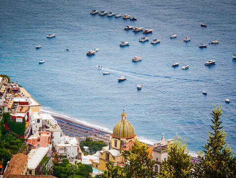 Stunning aerial drone panorama of Positano on the Amalfi Coast, Italy, colorful hillside houses, dramatic cliffs and the Mediterranean Sea