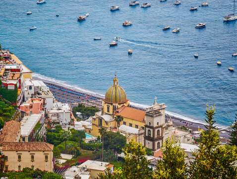 Church of Saint Mary of the Assumption in Positano, Italy, iconic historic church with its colorful majolica dome overlooking the stunning Amalfi Coast