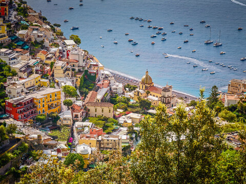 Stunning aerial drone panorama of Positano on the Amalfi Coast, Italy, colorful hillside houses, dramatic cliffs and the Mediterranean Sea