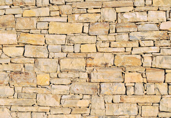 Fototapeta premium old dry stone wall close up