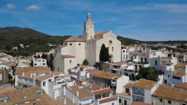 Aerial views of Cadaqu&eacute;s village and its iconic white church on the Costa Brava