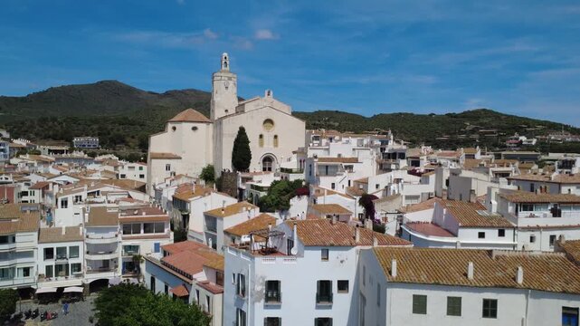 Aerial views of Cadaqu&eacute;s village and its iconic white church on the Costa Brava