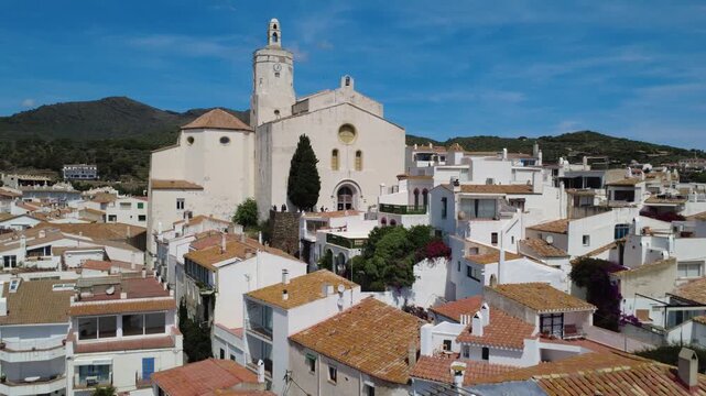 Aerial views of Cadaqu&eacute;s village and its iconic white church on the Costa Brava