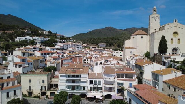 Aerial views of Cadaqu&eacute;s village and its iconic white church on the Costa Brava