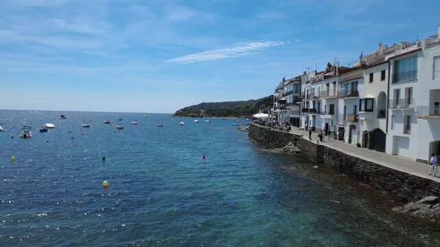 Aerial views of Cadaqu&eacute;s village and its iconic white church on the Costa Brava