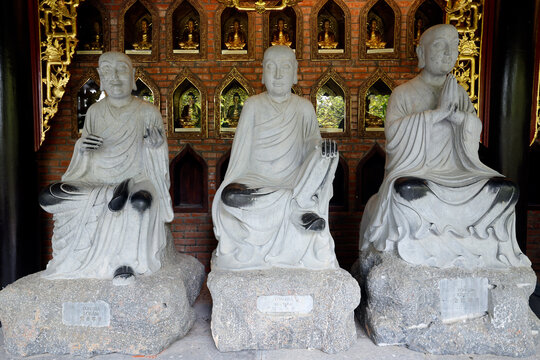 Bai Dinh Pagoda. Hall of the 500 Arhats. The white marble monks are enlightened disciples of the Buddha. Each arhat holds a specific attribute. Ninh Binh, Vietnam.