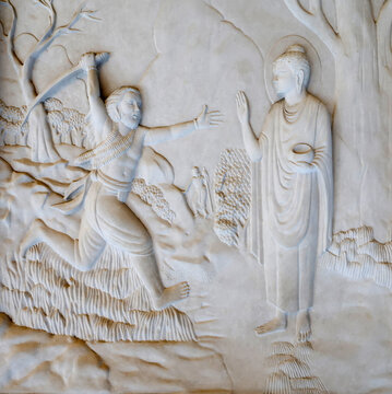 Bai Dinh Pagoda. A carved depiction of an ascetic attempting to attack the Buddha, symbolizing the struggle against inner demons and the quest for enlightenment. Ninh Binh, Vietnam.