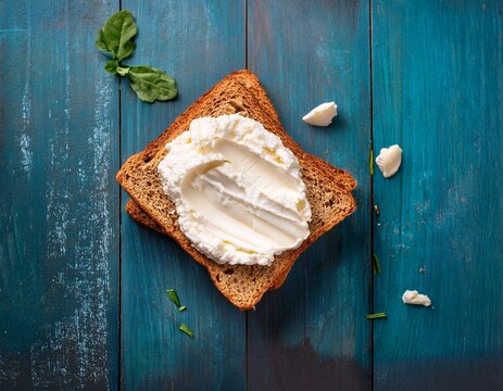 rustic flat lay of freshly baked bread cream top view cheese on white bread