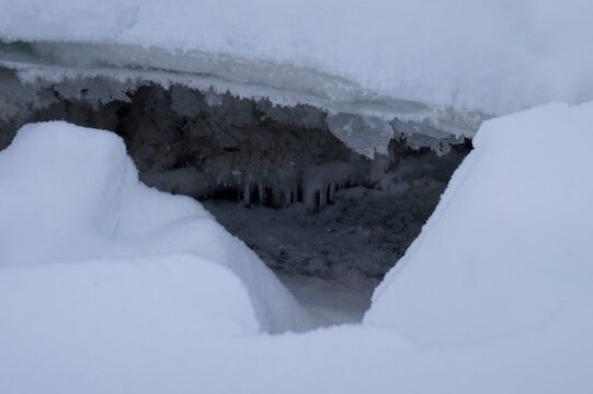 Hole in the snow over river