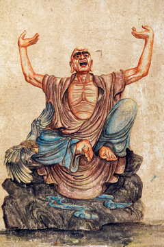 Bai Dinh Pagoda. Painting of a Buddhist ascetic meditating on a rock, accompanied by a bird. . Ninh Binh, Vietnam.