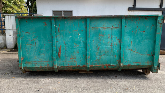 Large industrial waste container positioned outdoors for collection of construction and renovation materials