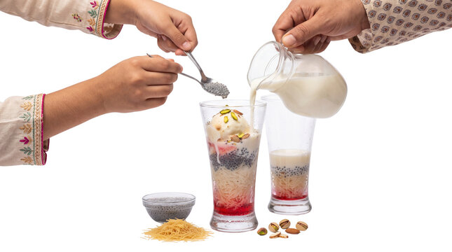 Traditional Falooda dessert preparation with milk pouring, sweet rose syrup and vermicelli layers, refreshing cold summer beverage with ice cream isolated PNG with Transparent Background