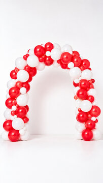 Red and white balloon arch decoration for celebration event