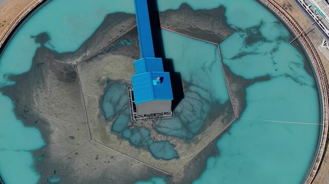 Manufacturing infrastructure of concentrate factory, Aerial top view. Industrial filtration treatment facility with sedimentation water tanks pulp in gold, copper mining industry.