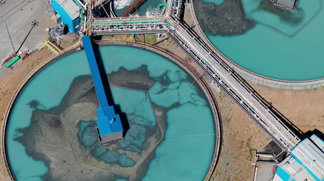 Manufacturing infrastructure of concentrate factory, Aerial view. Industrial filtration water and treatment facility with sedimentation tanks pulp in gold, copper mining industry.