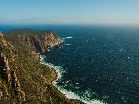 Forested slopes and the ocean in Cape Raoul, Tasmania, Australia.