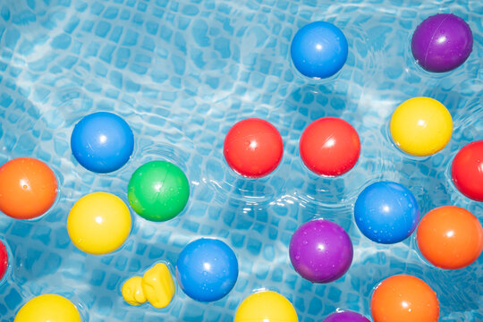 Colorful Floating Plastic Balls in Swimming Pool