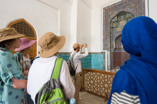 Tourists Listen to Guide in Bukhara, Uzbekistan