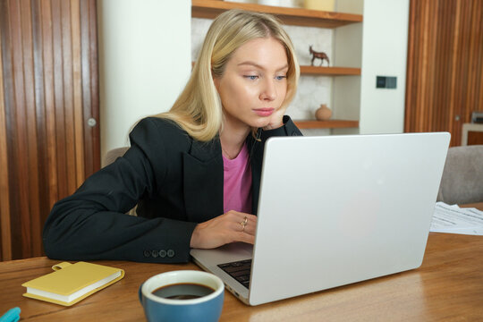 Serious Businesswoman Working on Laptop