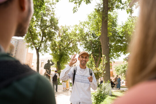 Group of People Enjoying a Guided Tour in a City Park
