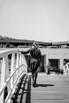 Crossing A Footbridge