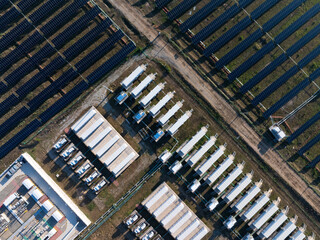 Aerial view of solar panel arrays and energy storage container station © zhu difeng