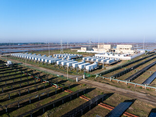 rows of battery energy storage containers in solar power station © zhu difeng