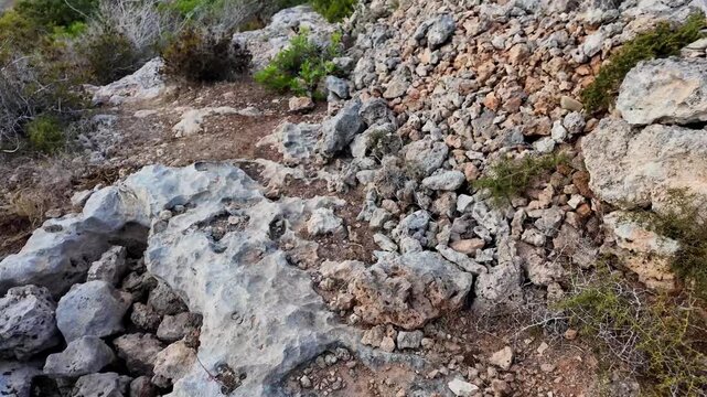 Ancient Cart Ruts on Xemxija heritage trail, parallel cartways groves cut into bare rock.