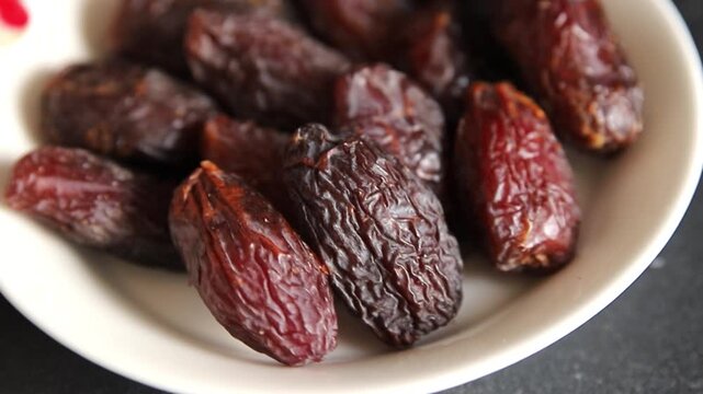 Dates sweet dessert edible fruits of the date palm food preparation tasty snack fresh and delicious gourmet food background on the table rustic food top view copy space keto and paleo diets vegetarian