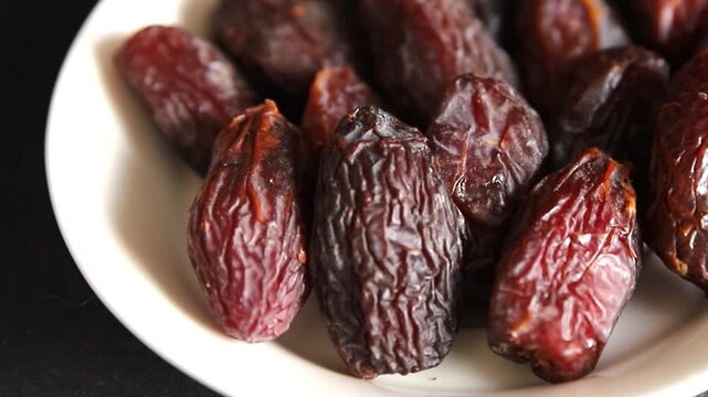 Dates sweet dessert edible fruits of the date palm food preparation tasty snack fresh and delicious gourmet food background on the table rustic food top view copy space keto and paleo diets vegetarian