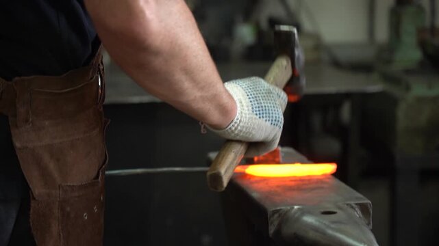 Master Blacksmith at Work: The Art of Forging Metal into Shape with Precision Hammering Techniques in a Traditional Workshop Setting